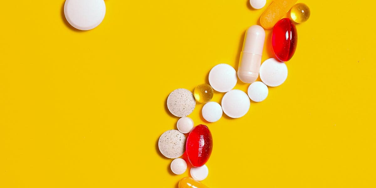 Medication vials and syringes on a medical tray
